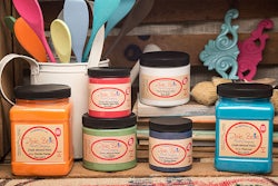 Several jars of Dixie Bell paint in various colors