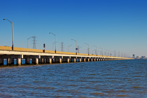 Image from the water of a span of the James River Bridge connecting Isle of Wight and Newport News