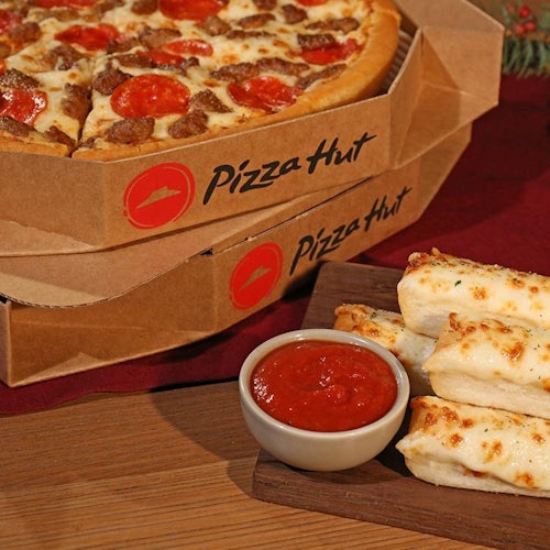 2 pizzas in boxes breadsticks and marinara sauce