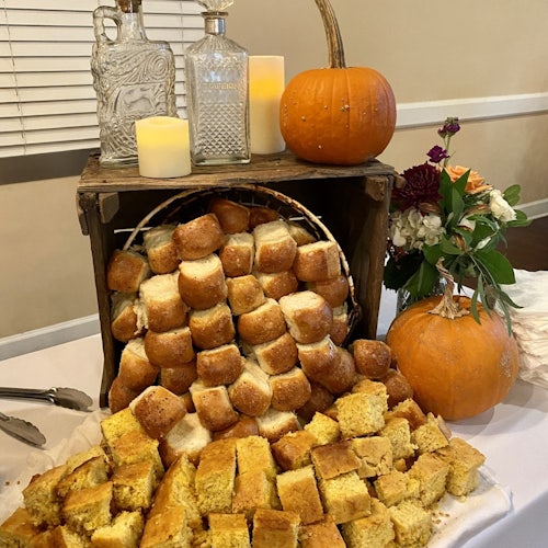 Table of biscuits and corn bread decorated by Country Boys BBQ