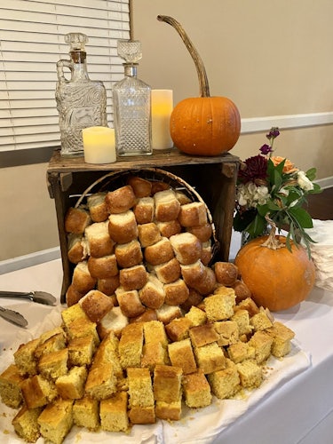 Table of biscuits and corn bread decorated by Country Boys BBQ